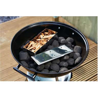 BBQ smoker box filled with coarse wood chips ready to smoke