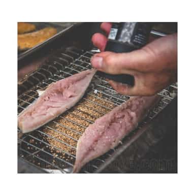 Preparing fish fillets for hot smoking in a portable smoker cooker