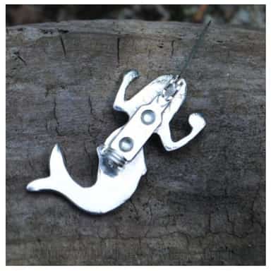 Mermaid brooch detail showing the highly polished pewter finish