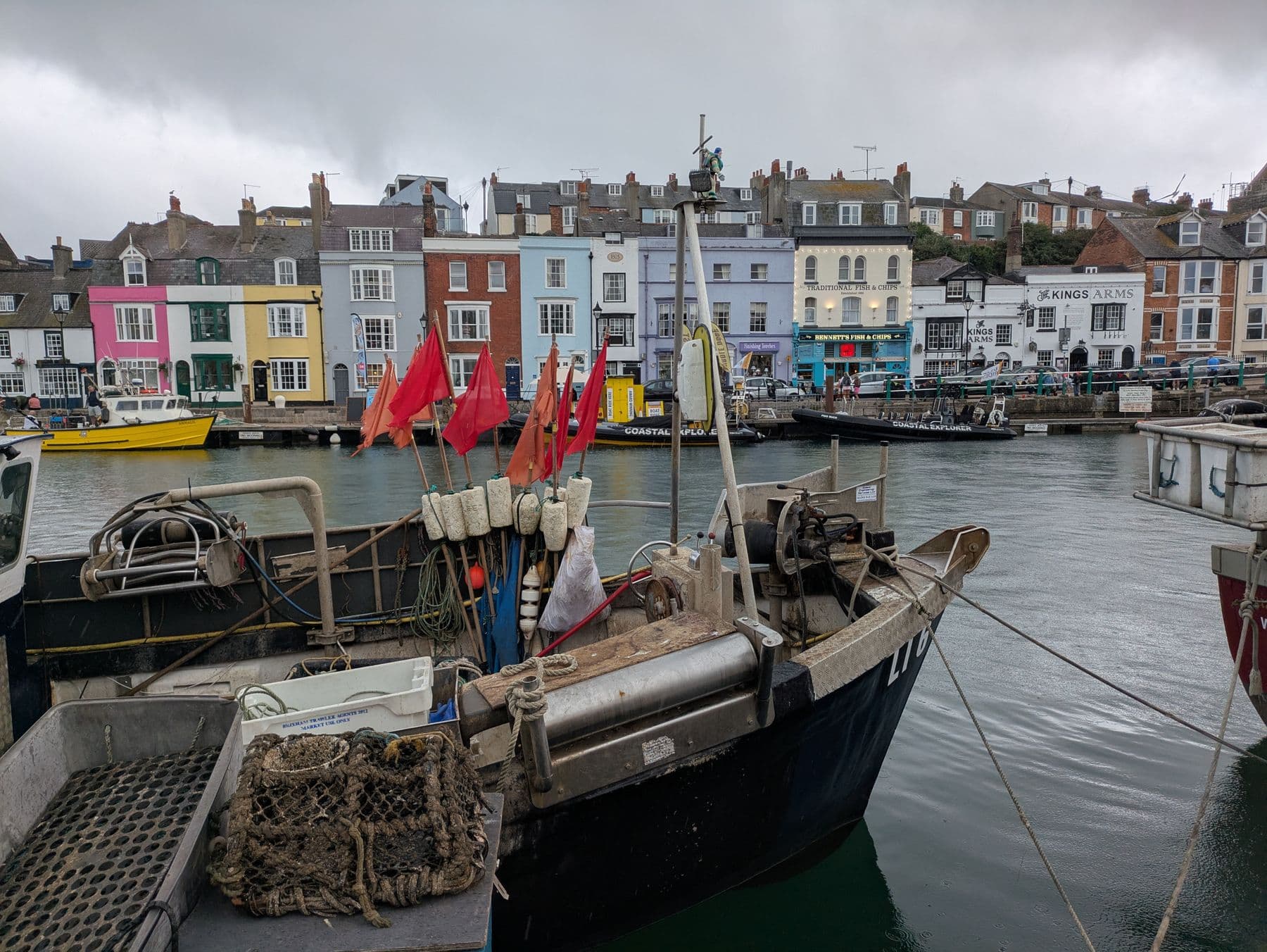 Fishing boats moored in a colourful British harbour