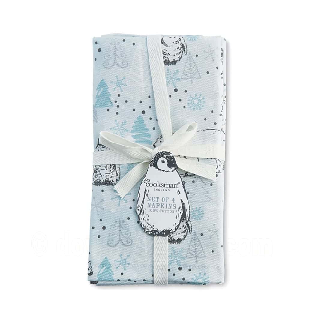 Cooksmart Frosty Morning set of four cotton napkins folded and tied with ribbon, pale blue with penguins, trees and snowflakes