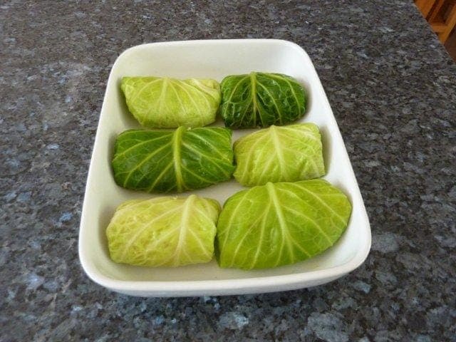 Carry on and roll up the remaining cabbage leaves and fish mixture.