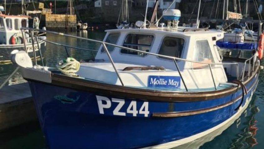 The Mollie May traditional Cornish fishing boat in Porthleven harbour, ready for a sightseeing trip.